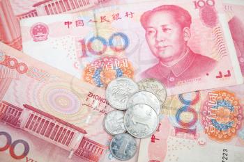 Modern Chinese yuan renminbi banknotes and coins, close up photo background