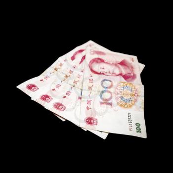 Modern Chinese yuan renminbi banknotes. Photo with selective focus isolated on black