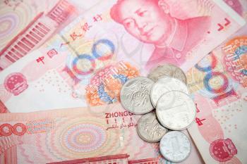 Chinese yuan renminbi banknotes and coins. Close up photo background