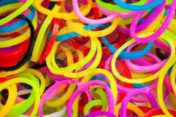 Macro photo of small round colorful rubber bands for making rainbow loom bracelets