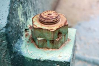 Macro photo of old rusted nuts and bolt, selective focus and shallow DOF