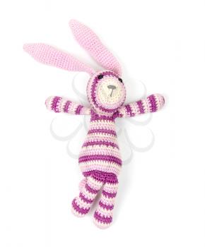 Funny knitted rabbit toy isolated on white background with soft shadow