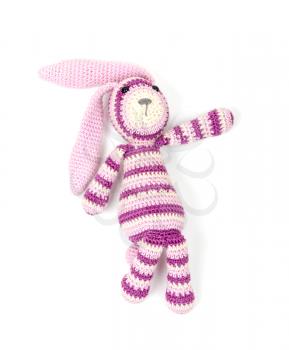 Funny knitted rabbit toy showing right direction isolated on white background with soft shadow