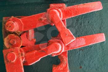 Abstract industrial details fragment, old grungy red lock mechanism 