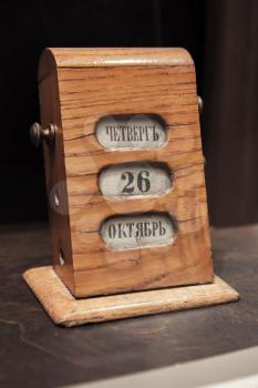 Ancient manual wooden calendar shows the date of October 26, Thursday with Russian text