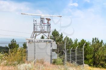 Observation radar station tower with different devices and cameras