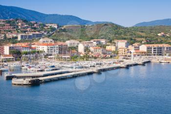 Port of Propriano, South region of Corsica island, France. Pier and coastal cityscape, sea view 
