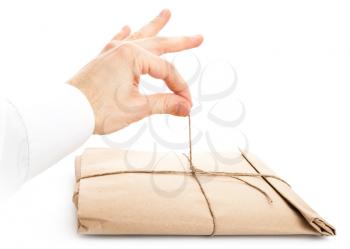 Male hand opening envelope tied with a rope isolated on white background