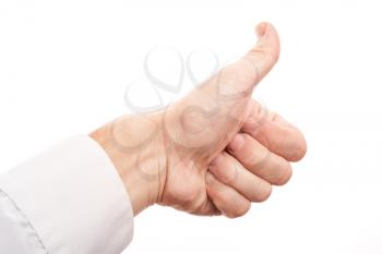 Closeup photo of male hand showing thumbs up gesture isolated on white background