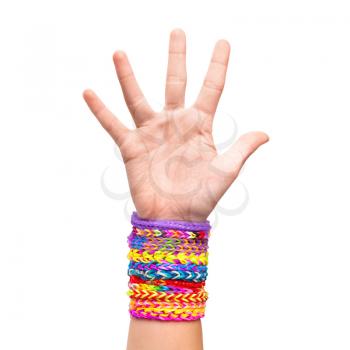 Hand with colorful rubber rainbow loom bracelets isolated on white, trendy kids fashion accessories 