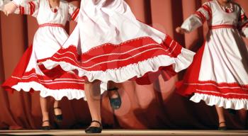 Bright fragment of fast Russian folk dance with red-white girls waved skirt