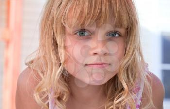 Closeup portrait of a little blond beautiful girl