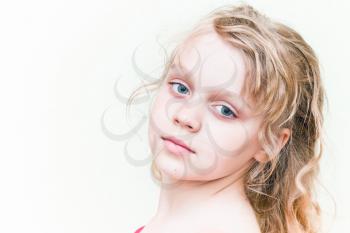 Portrait of a little blond girl above white background