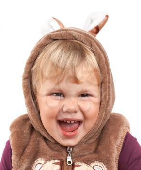 Portrait of funny laughing Caucasian baby girl in bear costume isolated on white