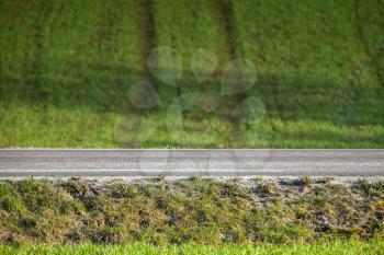 Abstract road background with asphalt speedway and field track