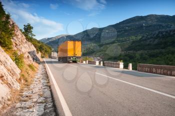 Trucks driving on asphalt mountain road in Montenegro
