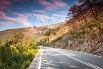 Mountain highway in soft morning sunlight. Montenegro