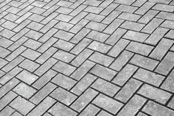 Background texture of gray cobblestone pavement