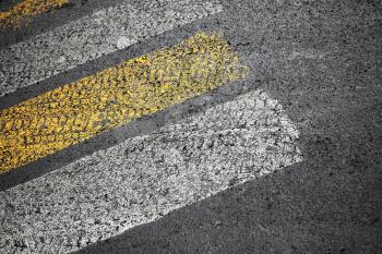 Pedestrian crossing road marking on dirty asphalt pavement
