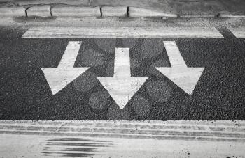 Pedestrian crossing road marking. Arrows and lines on asphalt