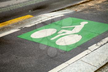 Bicycle lane. Green road marking on asphalt road
