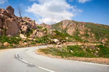 Turn of a mountain road, empty landscape of Corsica, France. Porto Vecchio region