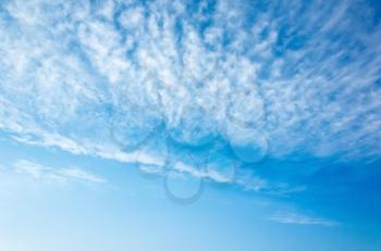 Natural bright blue sky with altocumulus cloud layers, background photo texture