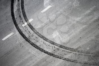 Abstract road background with crossing of road marking and tires track