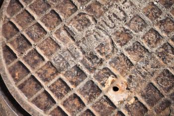 Old rusted sewer manhole closeup abstract fragment
