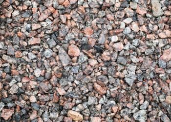 Detailed background texture of wet gravel ground after the rain