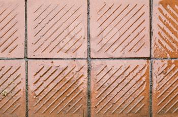 Shining wet brown vintage outdoor tile floor