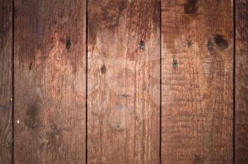 Detailed background texture of wet brown wooden lining boards