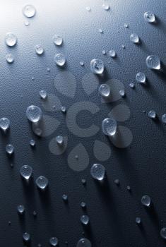 Water drops on the embossed surface of tension ceiling