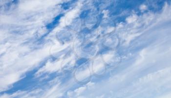 Beautiful windy clouds on the blue sky background
