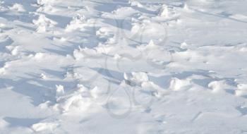 Texture of sharp hilly snowdrift with nice shadows