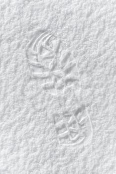 Texture of man's footprint in fresh soft snow