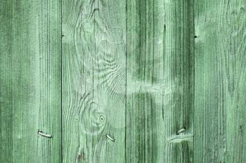 Old green wooden wall background texture with nails