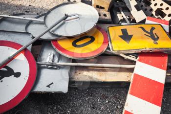 Heap of old used road signs, industrial construction area