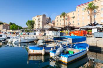 Colorful fishing boats moored in old port of Ajaccio, South Corsica, France