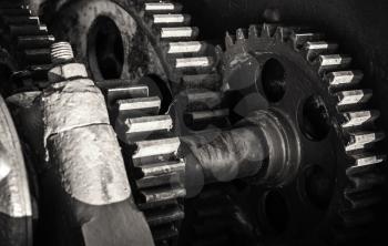 Old rusted gears, close-up black and white photo with selective focus