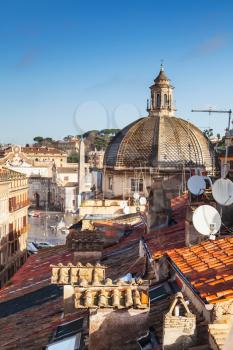 Old Rome, Italy. Via del Corso street view, vertical photo taken from the roof, looking on The Piazza del Popolo with dome of Basilica Santa Maria di Montesanto as a dominant landmark