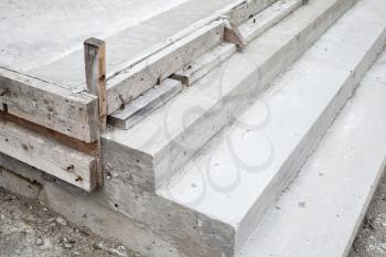 White stairs under construction, concrete steps and timber forms