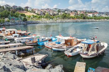 Old wooden fishing boats moored in small port of Avcilar, district of Istanbul, Turkey