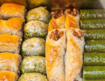 Baklava, it is a rich, sweet pastry made of layers of filo filled with chopped nuts and sweetened and held together with syrup or honey. Traditional cuisines of former Ottoman Empire and Middle East