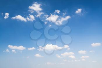 White clouds in deep blue sky, natural background photo