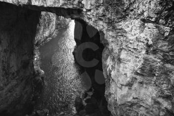 Black and white photo of Grotta del Turco. It is a popular grotto which ends directly in the sea. Gaeta, Italy 