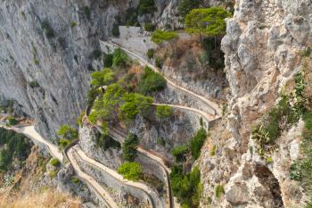 Old empty winding mountain road on Capri island, Italy