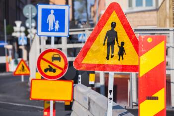 Warning roadsigns along European urban road under construction