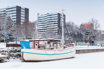 Winter cityscape of Turku, Finland. Ship restaurant moored in ice