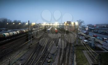 Sorting railway station with cargo trains at night